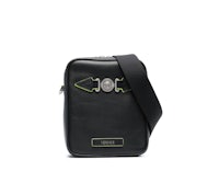 a black cross body bag with a green strap