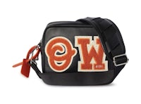 a black and orange cross body bag with the word w on it